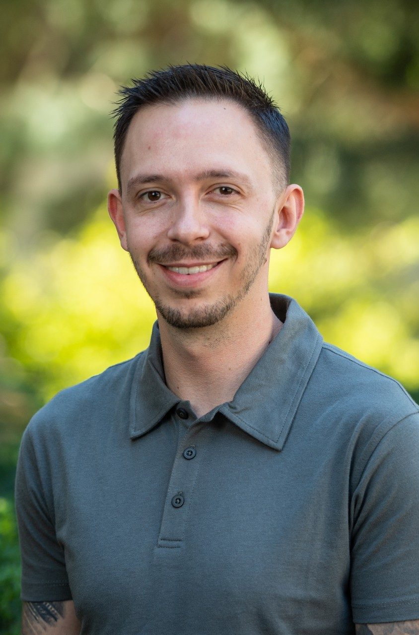Smiling man with short hair