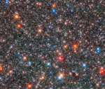 HST image of Milky Way Bulge Picture of a crowded field of stars some red, some blue of varying brightness
